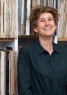 woman in front of shelf with records