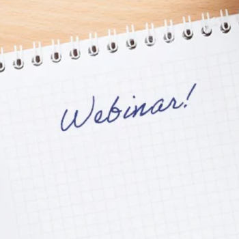 handwritten text "Webinar" on a piece of paper